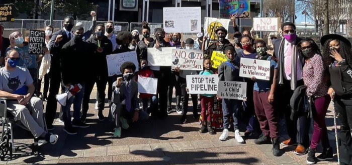 Memphis Community Against Pollution group holding protest signs