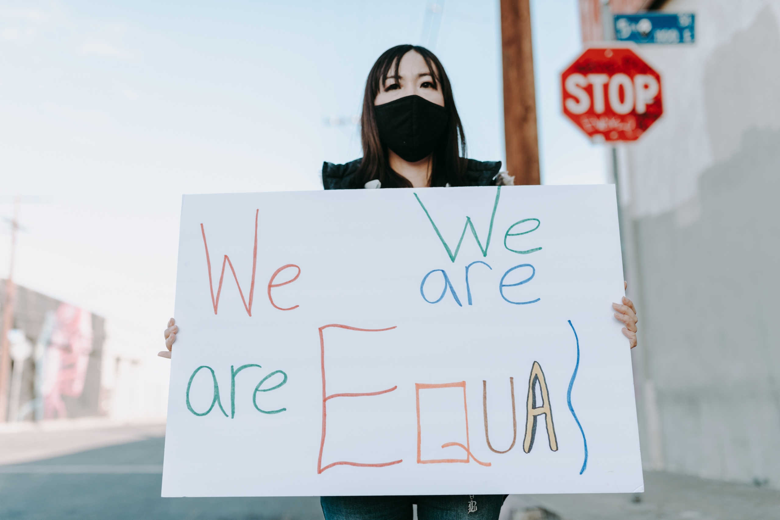 a-woman-holding-a-protest-banner